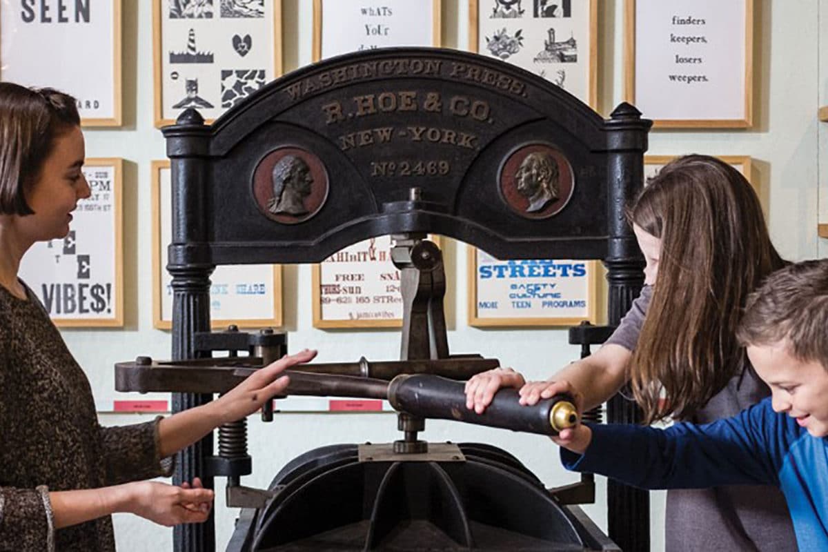 visitors touching the equipment at bowne & co