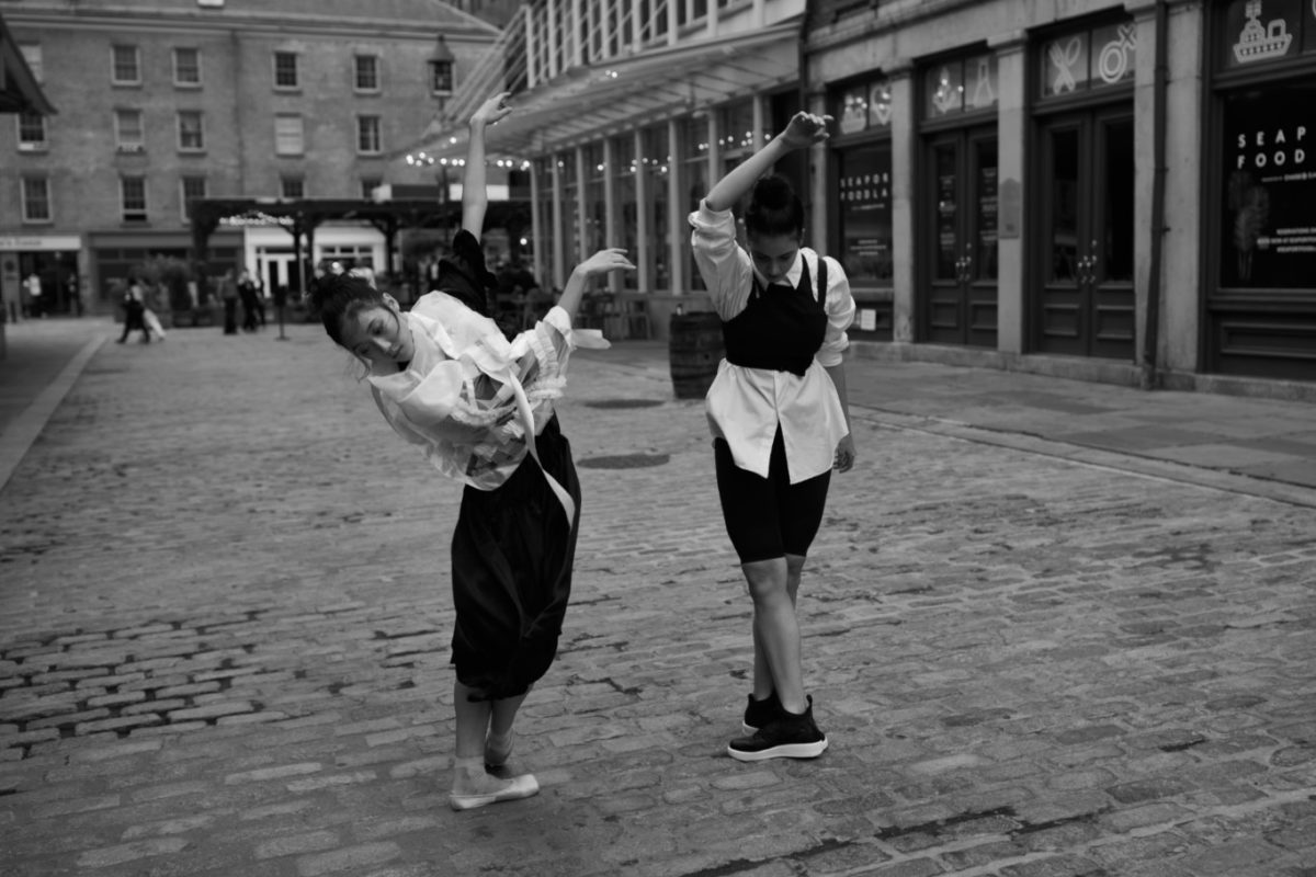woman performing ballet on the cobblestones