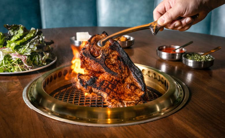 pork shoulder over a tabletop grill