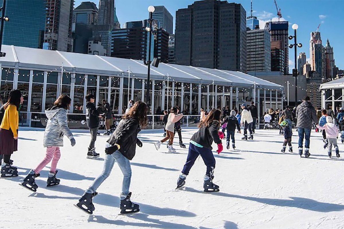 skaters enjoying a sunny day on the winterland rink at pier 17