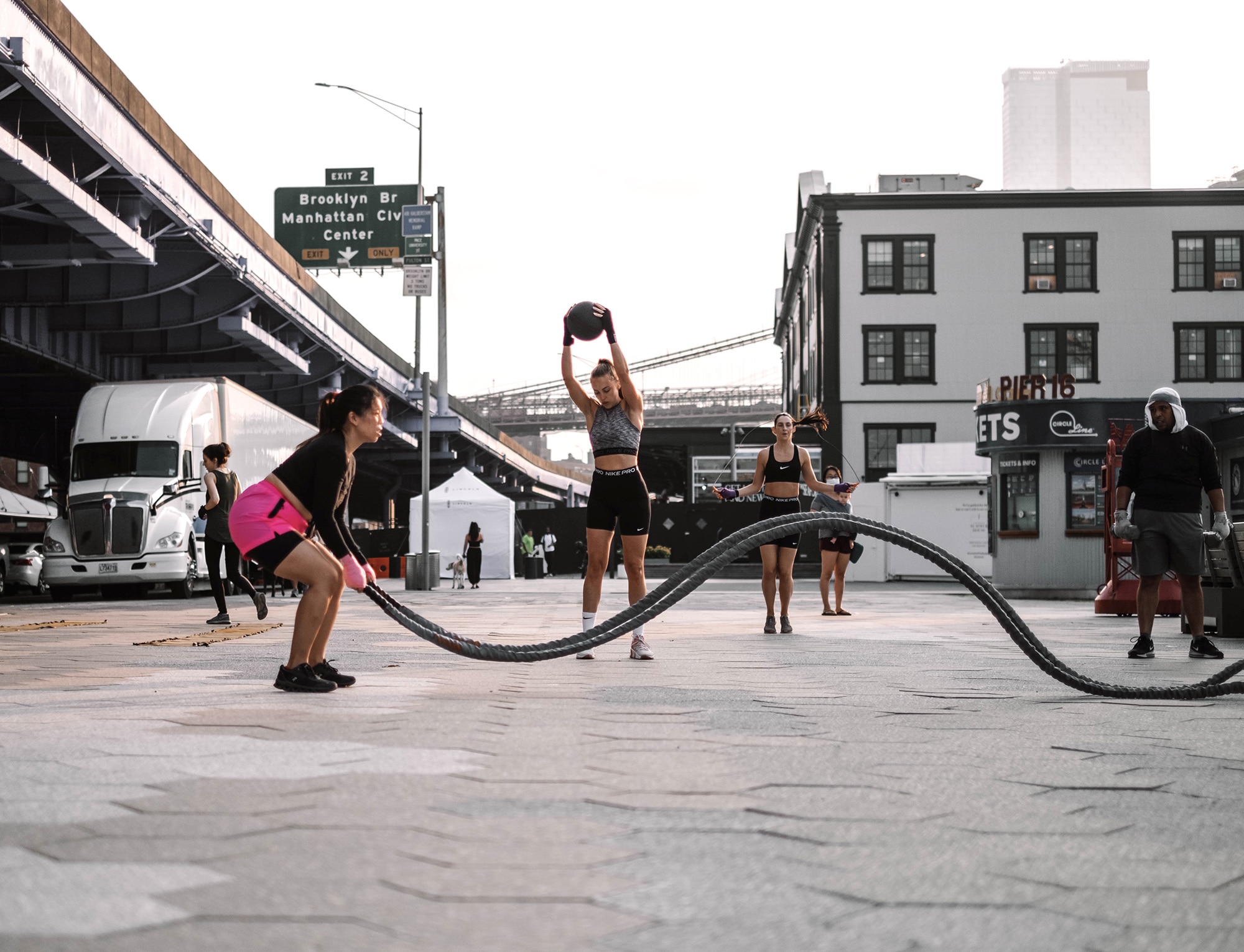 men and women working out on Seaport Square