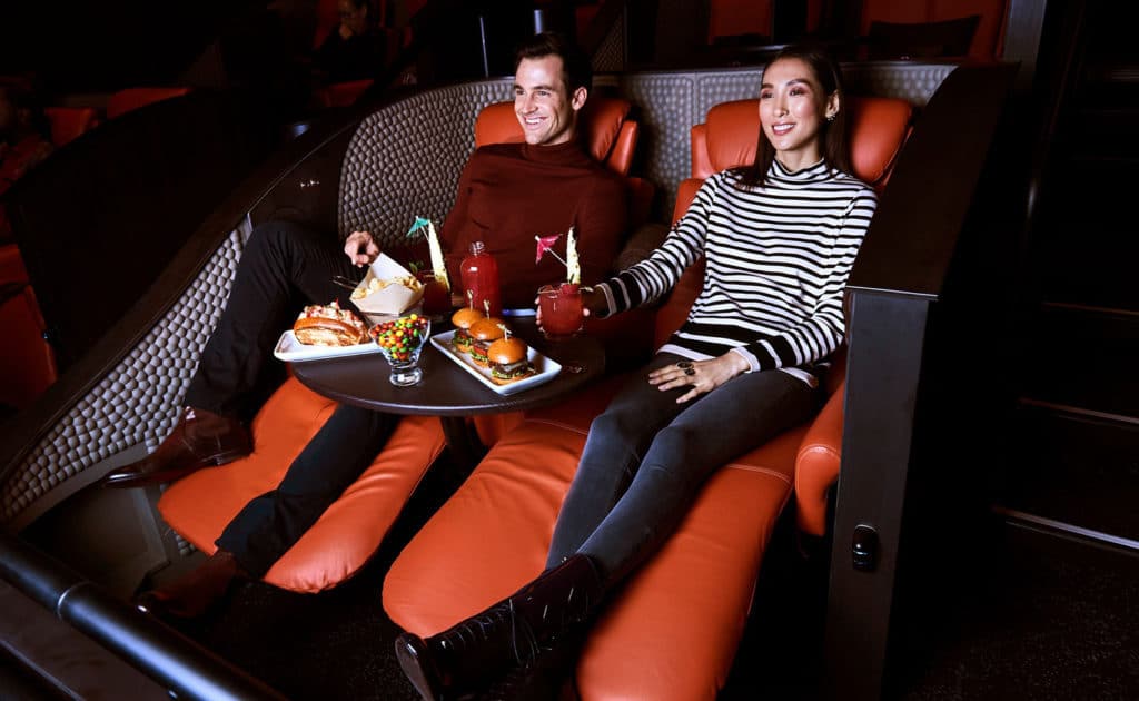 Couple enjoying a movie at IPIC Theaters