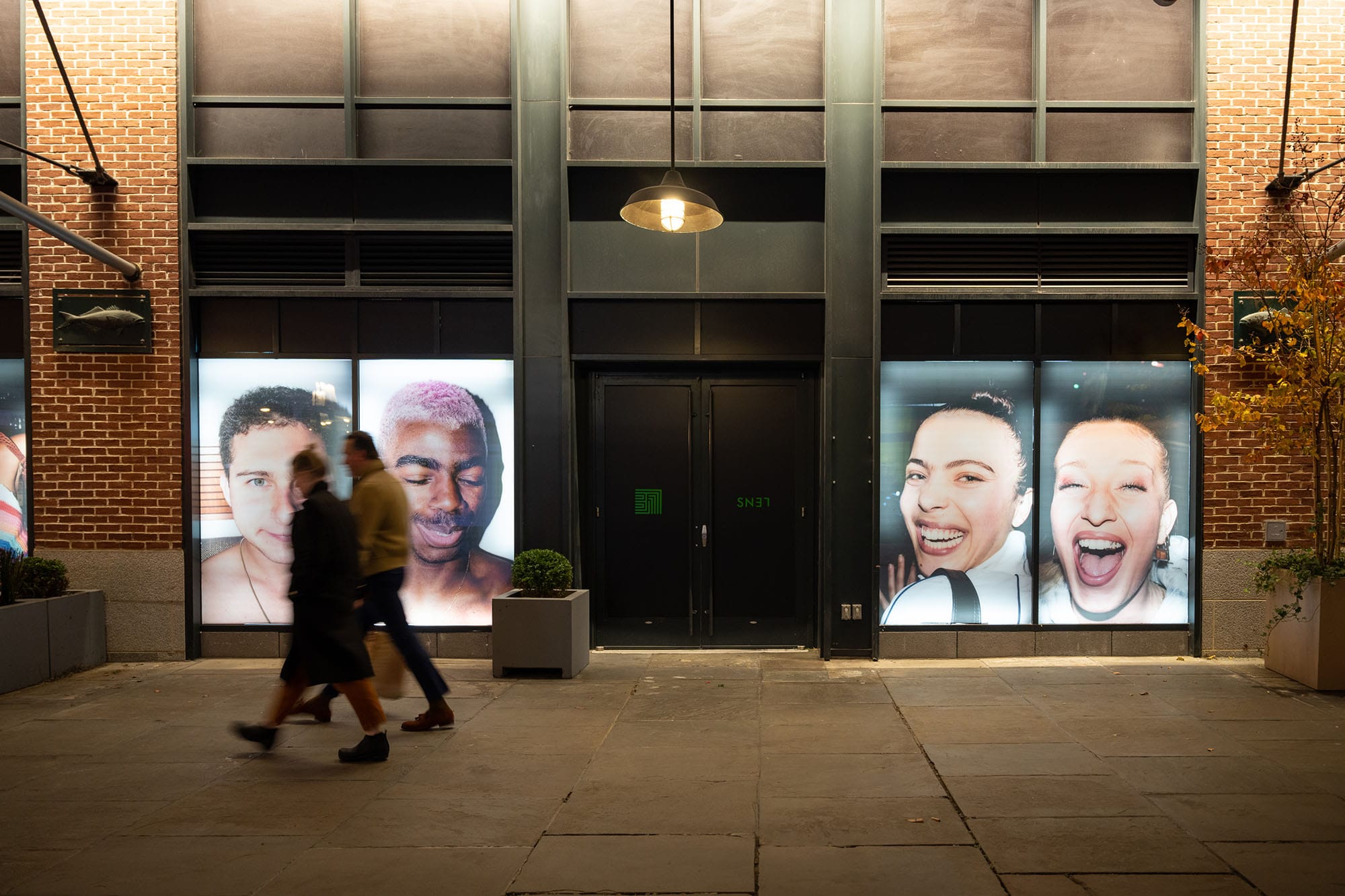 Window panels of Tyrell Hampton's photography at the SN37 Gallery