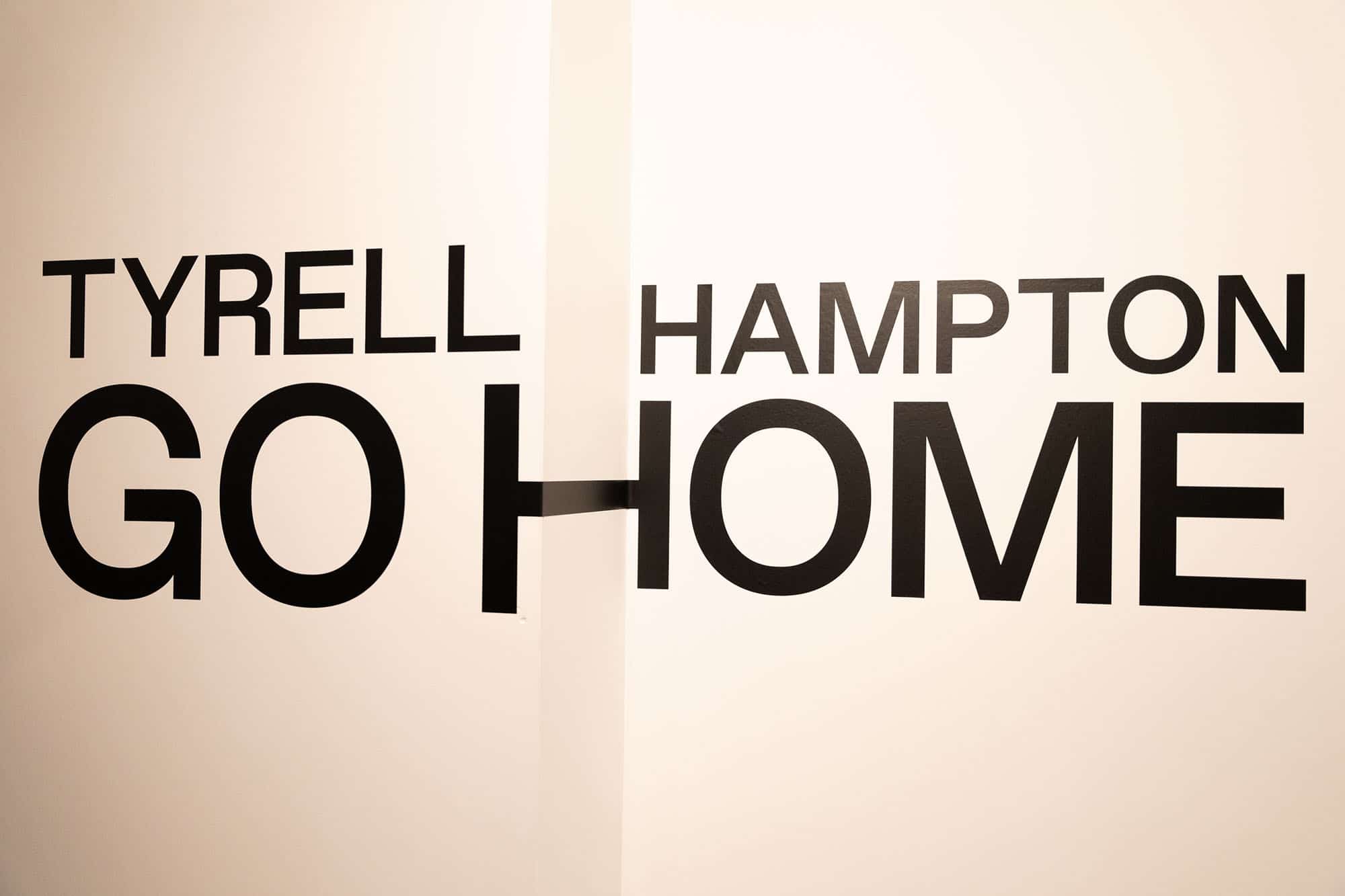 Tyrell Hampton - Go Home printed on a wall