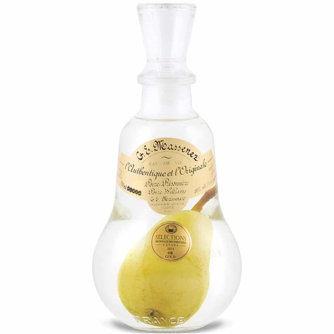 Clear bottle of Massenez Poire Williams pear brandy with pear in the bottle