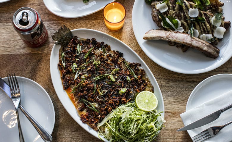 dishes with fish and steak on plates at Sunday in Brooklyn