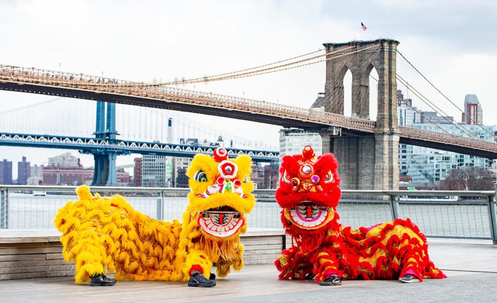 Lion Dancers in front of the Brooklyn Bridge