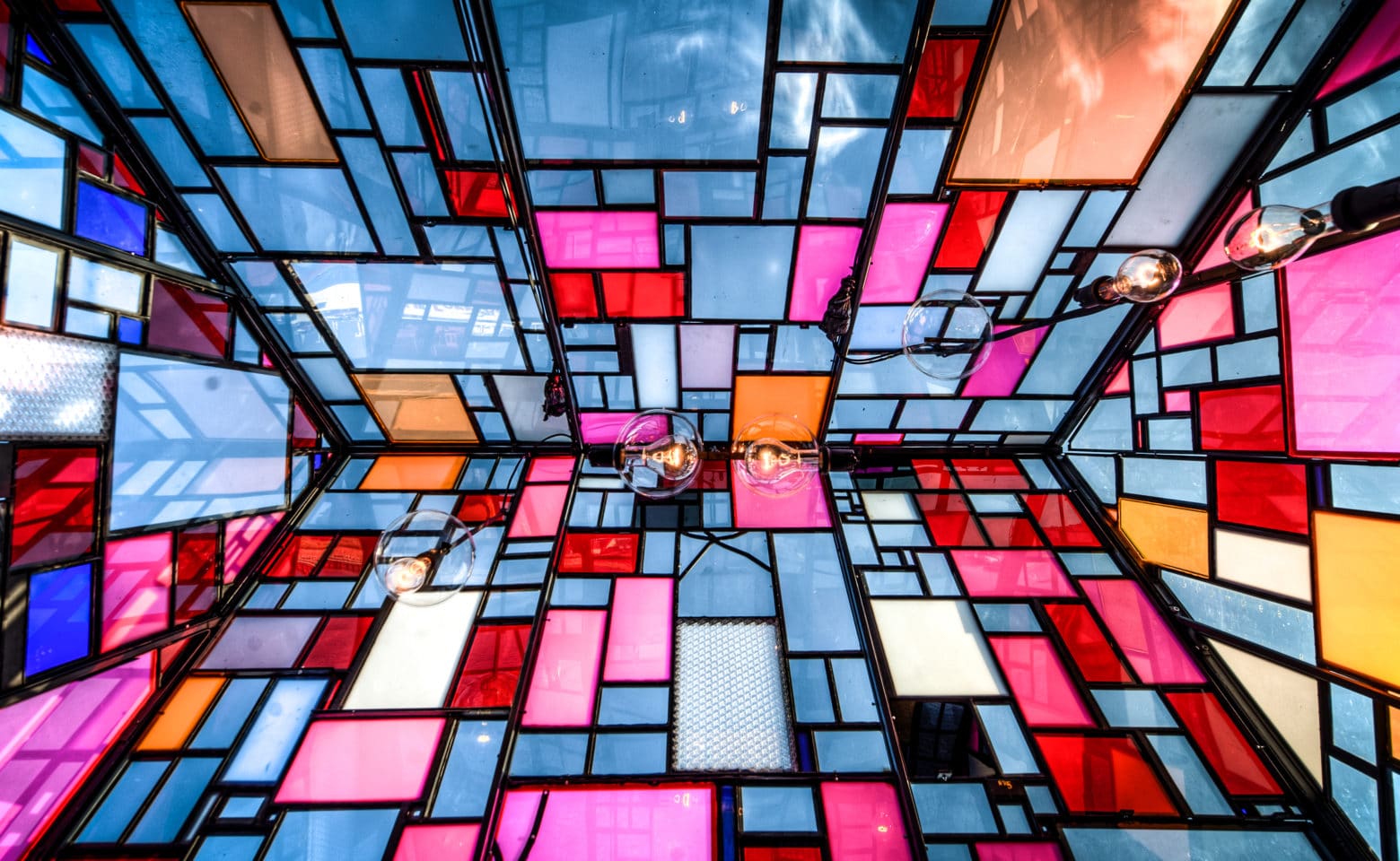 Inside a stained glass house by Tom Fruin