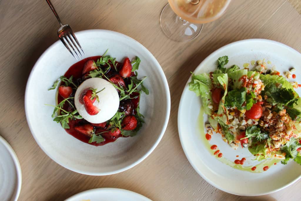Image of two plates of fresh salads