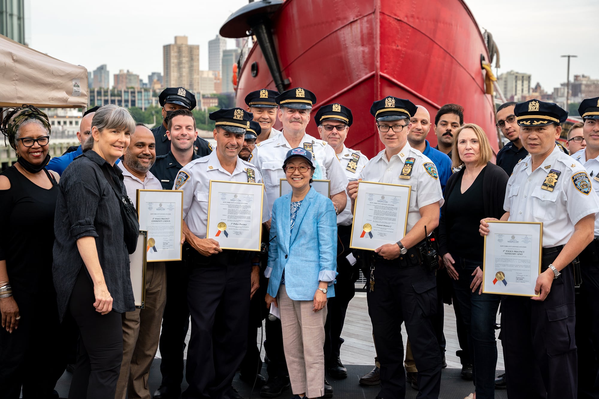 NYPD Officers holding awards at Pier 17