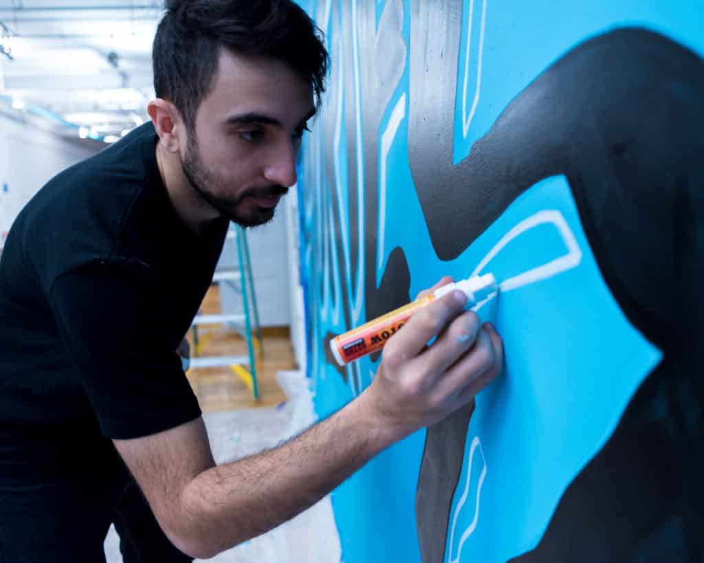 mural artist will pay painting a blue and black mural