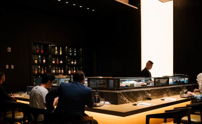 people sitting at bar at Shikoku restaurant at Tin Building