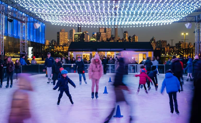people skating at the ice rink at Pier 17