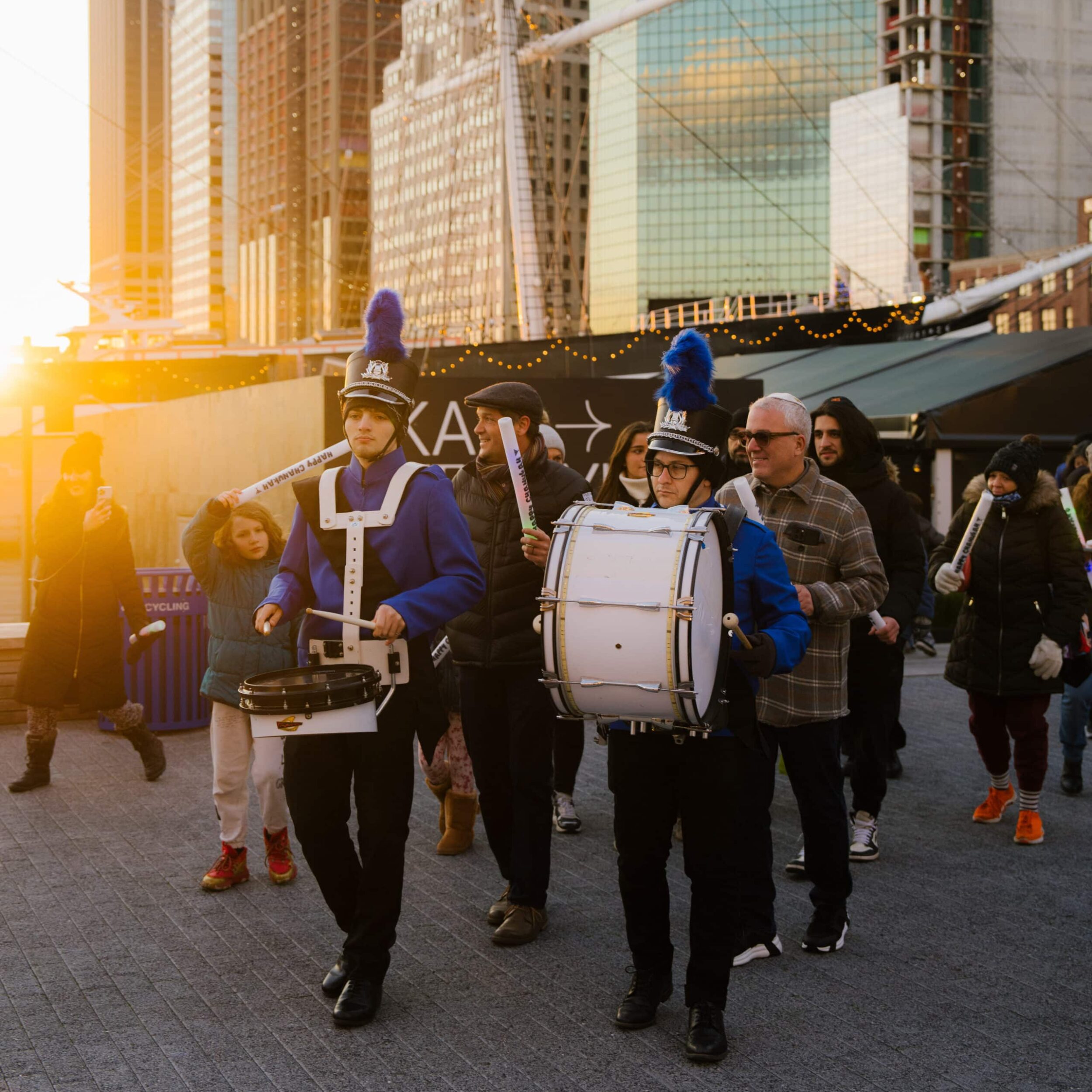 Musical Performance by the FiDi Hebrew School marching band performing at chanukah in the seaport