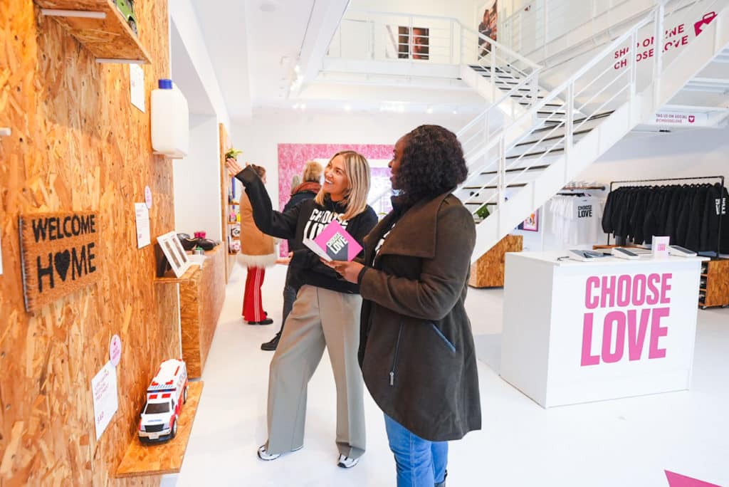 people shopping at the Choose Love pop-up at the Seaport
