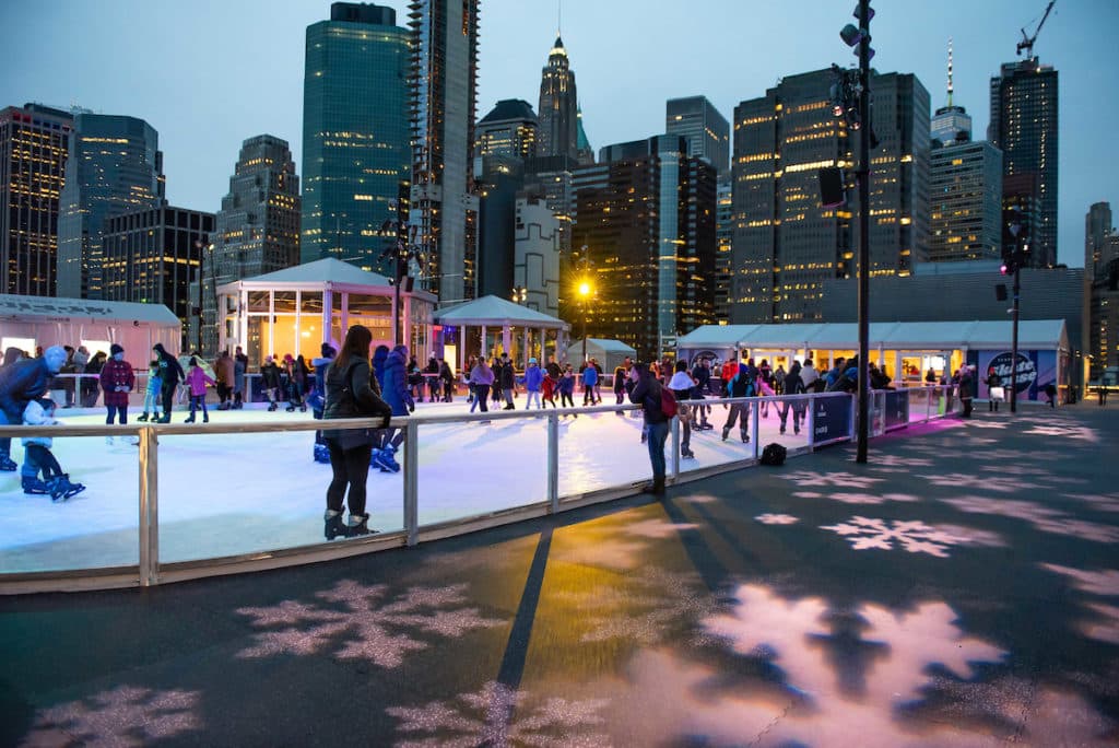 people skating on the ice rink at Pier 17