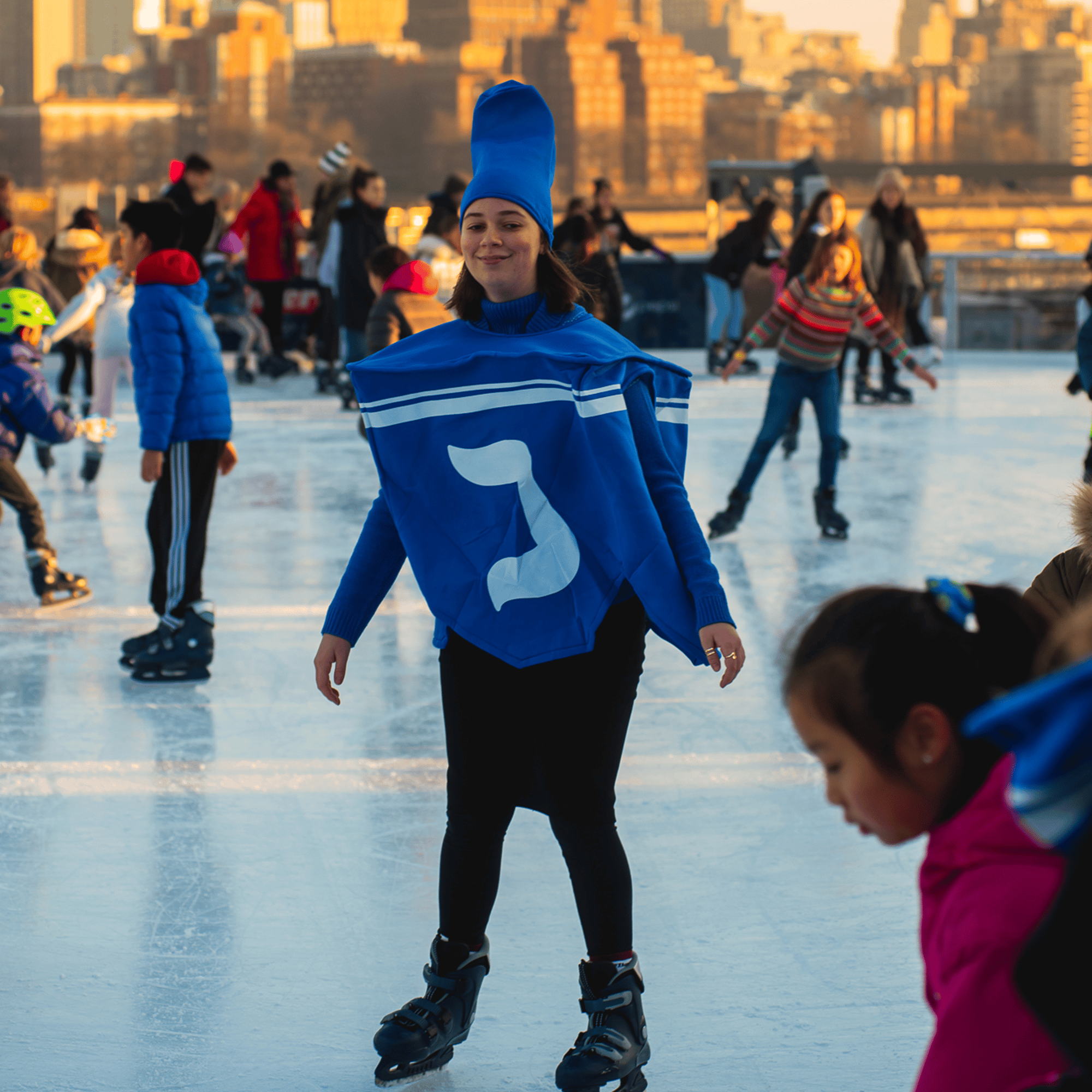 skating dreidels on the ice rink at Pier 17