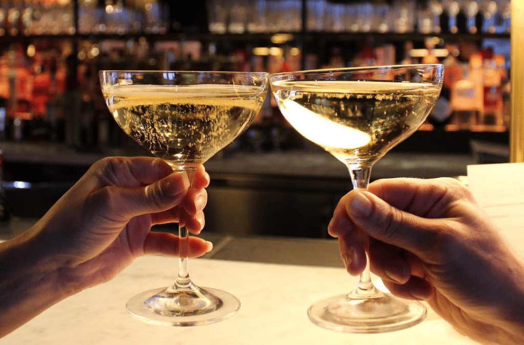 people cheers'ing with champagne glasses on New Years Eve at the Seaport