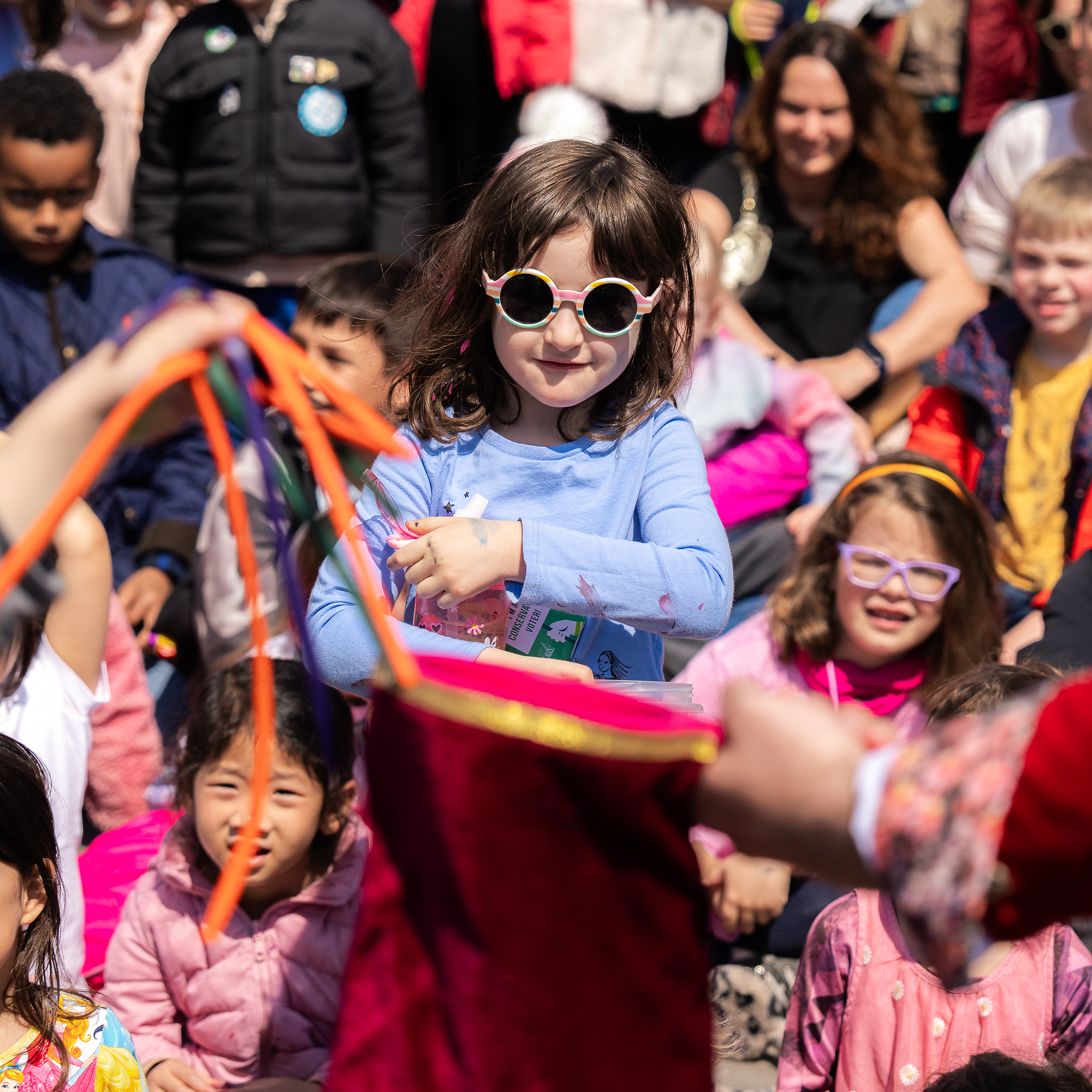 Girl wearing glasses at the Magic Show at the Kids event at the Seaport