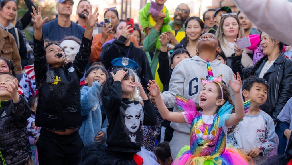 a group of children in halloween costumes have fun at the seaport