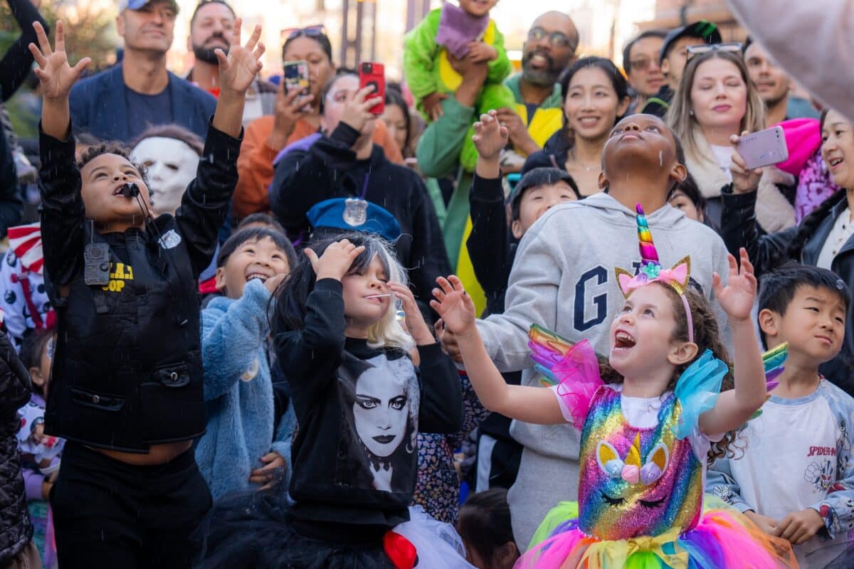 a group of children in halloween costumes have fun at the seaport