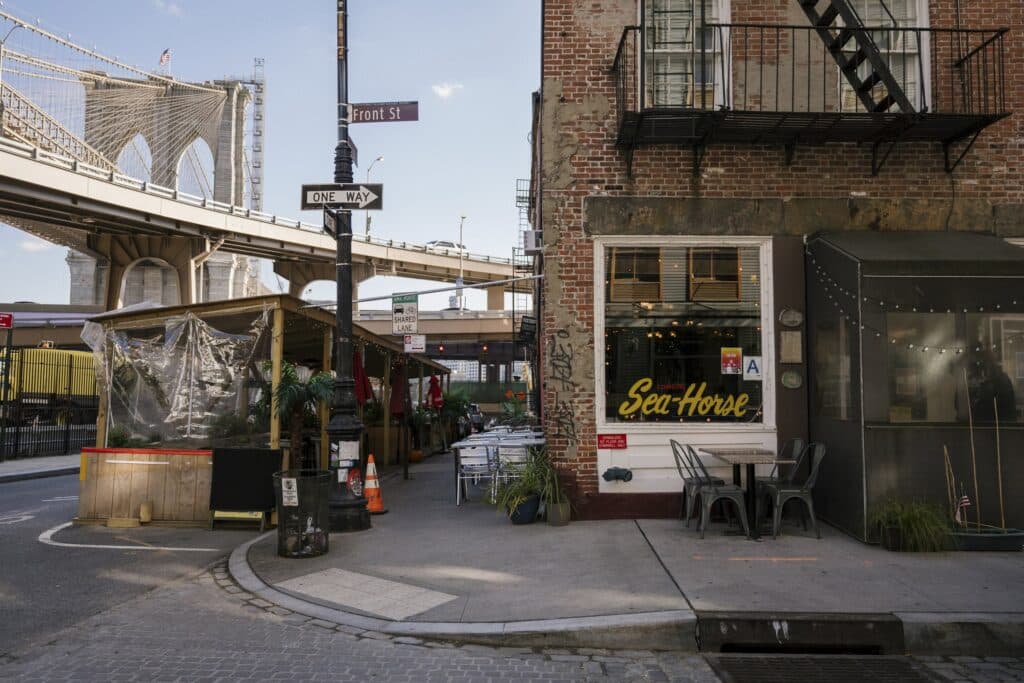 cowgirl seahorse bar at the seaport nyc, under the brooklyn bridge