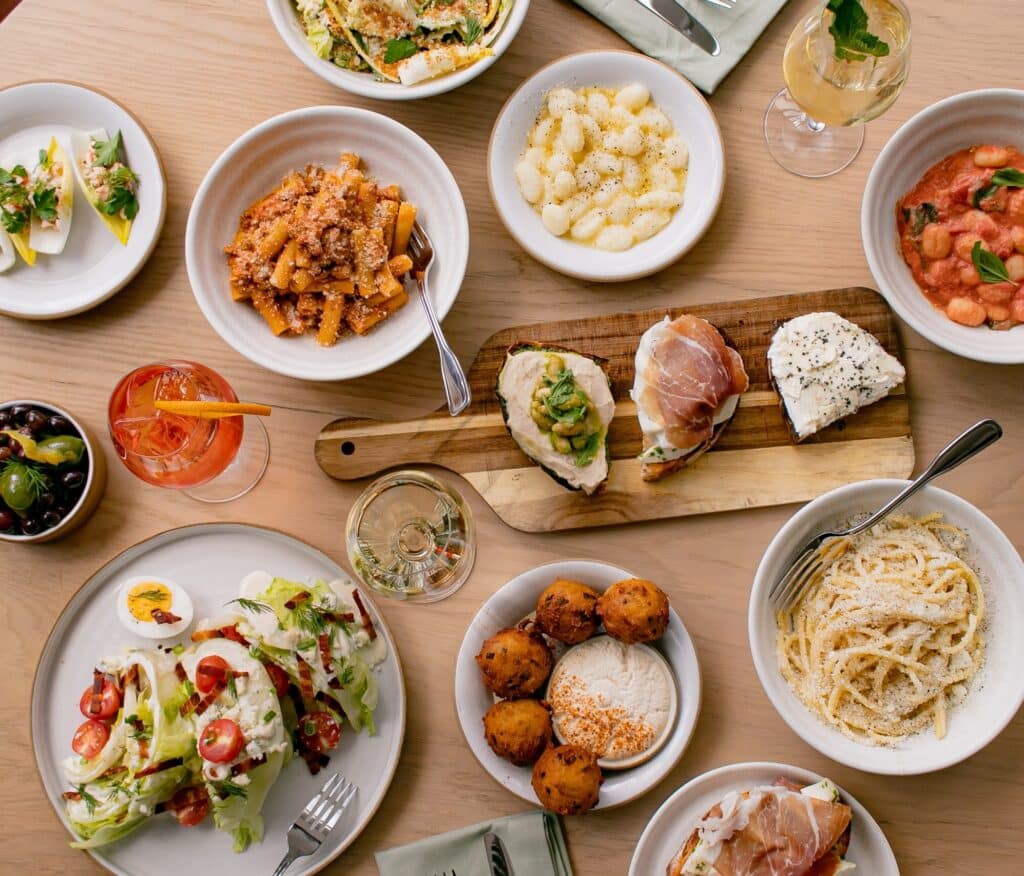 a spread of new american food at sadie's at the seaport