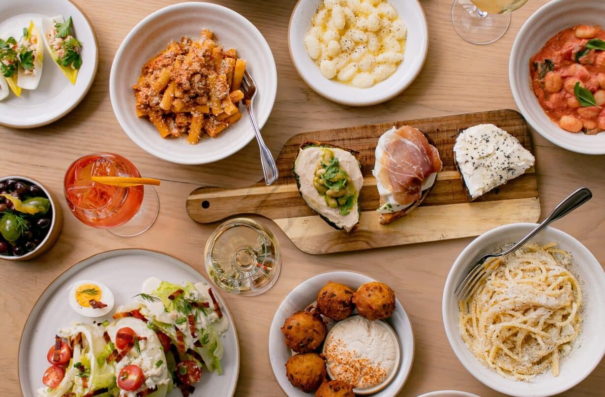a spread of new american food at sadie's at the seaport
