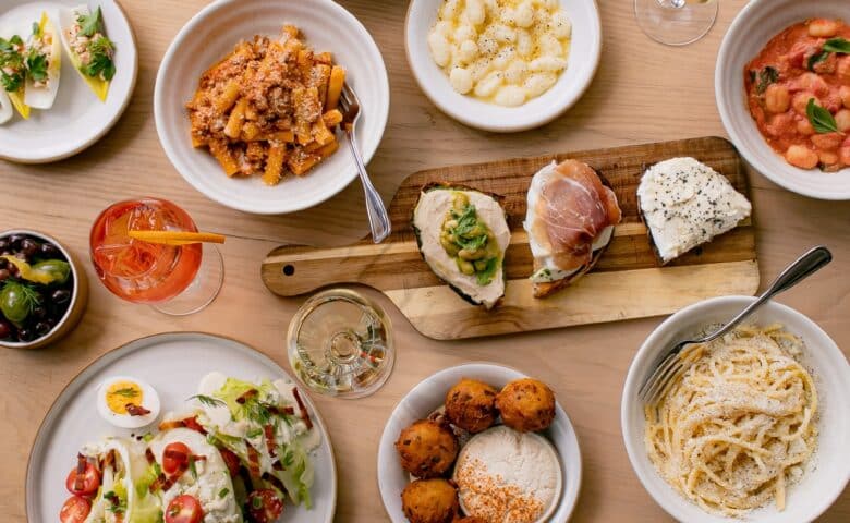 a spread of new american food at sadie's at the seaport