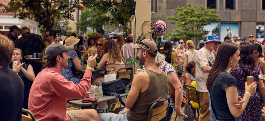a group of people gathered at sadie's garden bar for the world cup