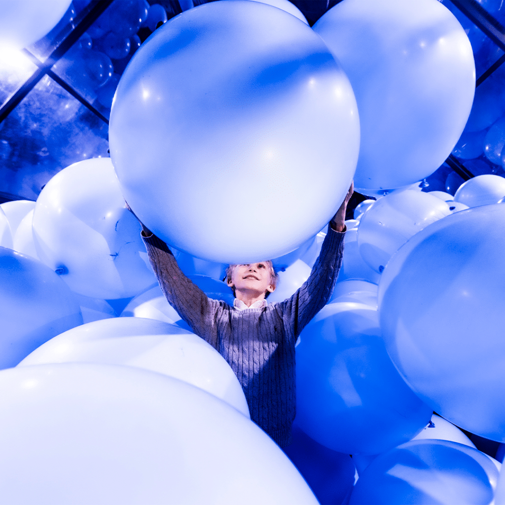 a child in an exhibit at balloon museum