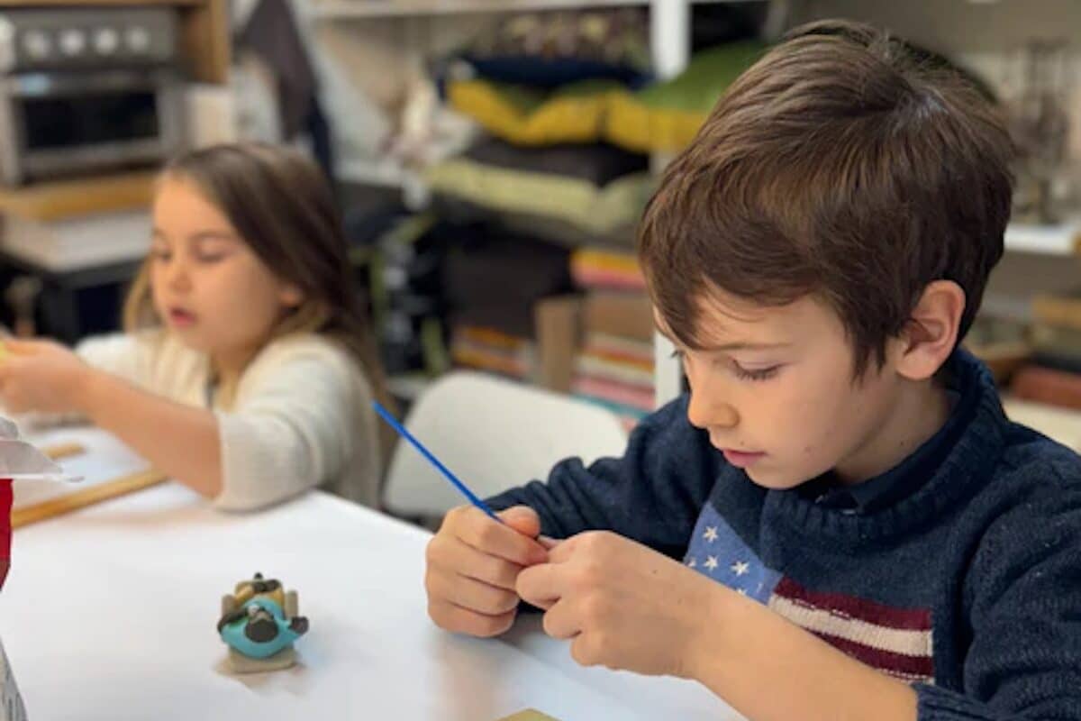 a child decorating a cookie