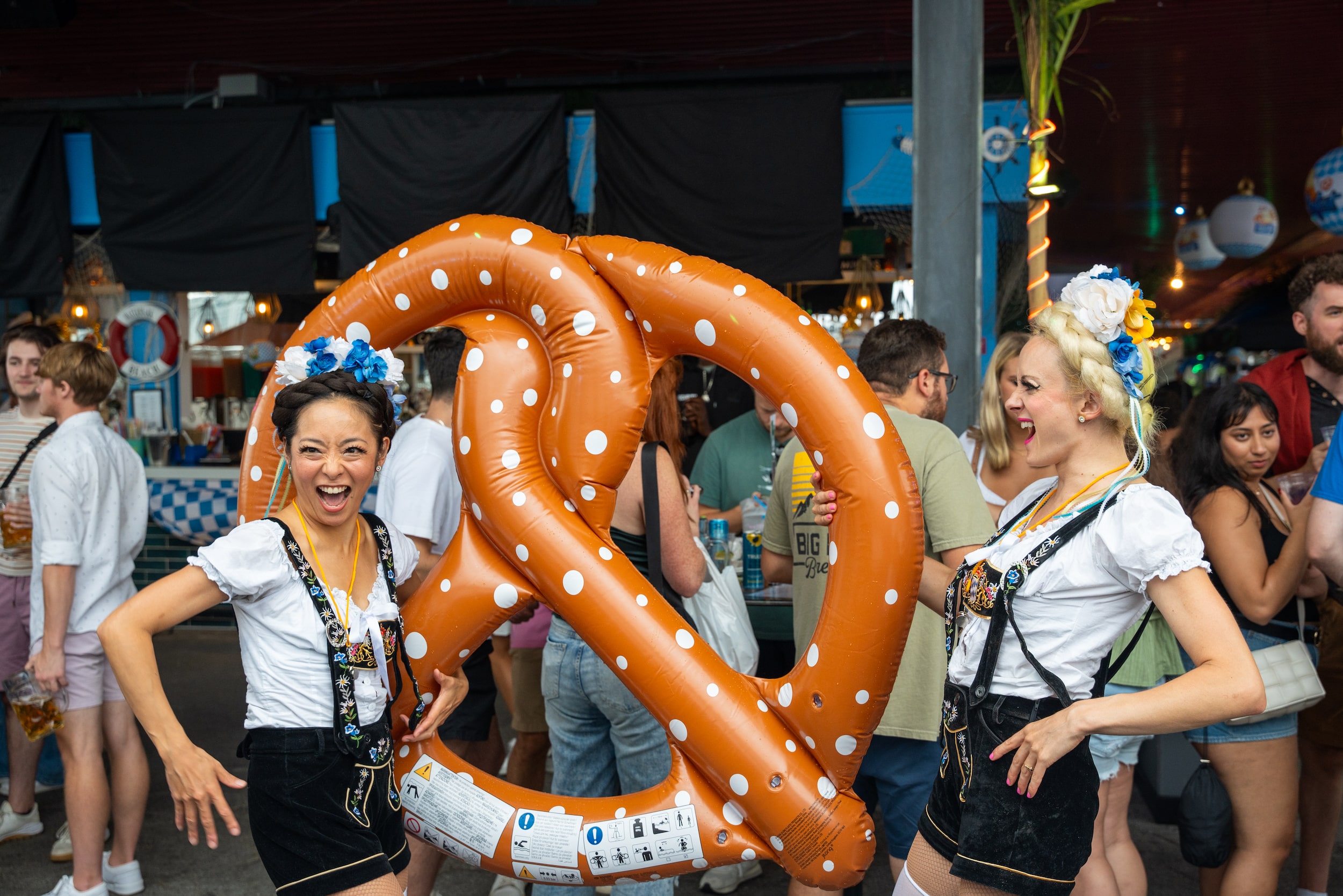 OktoberFest NYC - German Lederhosen Models With Jumbo Pretzel