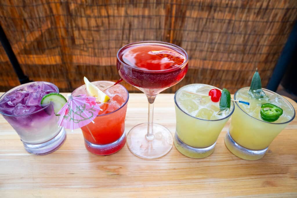 a line of 5 speciality cocktails at industry kitchen