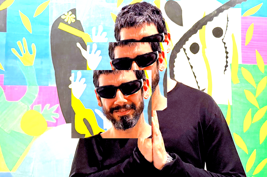 photo of musical artist Tall Juan; a man with short salt and pepper hair, beard, and mustache, wearing sunglasses in front of a colorful abstract background